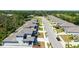 Aerial view of townhomes in a community surrounded by mature trees at 2926 River Run Way, Bradenton, FL 34208