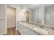 Bathroom features double sinks, granite countertops, and a walk-in shower at 2926 River Run Way, Bradenton, FL 34208