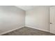 Empty bedroom features neutral carpeting, base molding, and ample natural light at 2926 River Run Way, Bradenton, FL 34208
