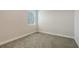 Clean and well-lit bedroom with neutral carpeting and base molding at 2926 River Run Way, Bradenton, FL 34208