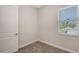 Light filled bedroom featuring a window with blinds, neutral walls and carpeting at 2926 River Run Way, Bradenton, FL 34208