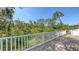 Outdoor deck overlooking lush vegetation, offering privacy and scenic views at 2926 River Run Way, Bradenton, FL 34208