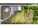 Aerial view of property highlighting outbuildings and open green spaces at 29527 Maris Dr, Punta Gorda, FL 33982