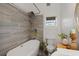 Modern bathroom with a soaking tub, elegant tile, and stylish fixtures for a serene bathing experience at 29527 Maris Dr, Punta Gorda, FL 33982