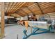 Large garage with an airboat, truck, and additional equipment storage at 29527 Maris Dr, Punta Gorda, FL 33982
