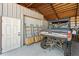 Interior view of a garage featuring an ATV and shelving at 29527 Maris Dr, Punta Gorda, FL 33982