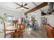 Bright kitchen and dining area with stainless steel appliances, an island, and brick backsplash at 29527 Maris Dr, Punta Gorda, FL 33982