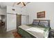 Bright main bedroom featuring a platform bed, concrete floors, barn door closet, and a view to the other living spaces at 29527 Maris Dr, Punta Gorda, FL 33982