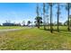 Expansive property featuring mature trees and a long driveway leading to the home at 29527 Maris Dr, Punta Gorda, FL 33982
