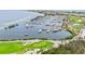 Aerial view of golf course, marina, and waterfront property at 3030 Grand Bay Blvd # 324, Longboat Key, FL 34228