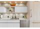 Bright kitchen featuring sleek white cabinets and quartz countertops at 3030 Grand Bay Blvd # 324, Longboat Key, FL 34228