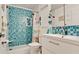 Charming bathroom featuring a blue mosaic tiled shower and modern sink vanity at 3112 Cambridge Ave # 6, Bradenton, FL 34207