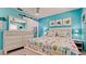 Tastefully decorated bedroom featuring coastal art and decor in a relaxing blue color scheme at 3112 Cambridge Ave # 6, Bradenton, FL 34207
