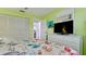 Comfortable bedroom with bright walls and a beach-themed bedspread, featuring closet space at 3112 Cambridge Ave # 6, Bradenton, FL 34207