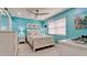 Bright bedroom with coastal decor and a beach-themed bedspread at 3112 Cambridge Ave # 6, Bradenton, FL 34207