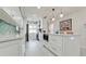 Well-lit kitchen with a center island, modern appliances, and white cabinets, great for cooking at 3112 Cambridge Ave # 6, Bradenton, FL 34207