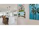 Bright kitchen featuring white cabinets, island with seating, and stylish decor, creating an inviting space at 3112 Cambridge Ave # 6, Bradenton, FL 34207