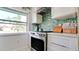 Kitchen area with modern oven, lots of counter space, and large window at 3112 Cambridge Ave # 6, Bradenton, FL 34207
