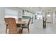 Open-concept kitchen and dining area featuring an island, stylish seating, and plenty of natural light and modern appliances at 3112 Cambridge Ave # 6, Bradenton, FL 34207