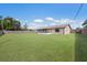 A spacious backyard with a screen-enclosed patio, offering a serene outdoor living space at 3123 40Th W Ave, Bradenton, FL 34205