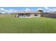 Large, level backyard featuring a screened lanai, ideal for entertaining or relaxing outdoors at 3123 40Th W Ave, Bradenton, FL 34205