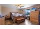 Cozy bedroom with wood floors, ceiling fan, and natural light; Quilt on bed at 3123 40Th W Ave, Bradenton, FL 34205