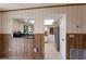 View from dining area into the kitchen with bright natural lighting at 3123 40Th W Ave, Bradenton, FL 34205