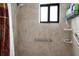 Accessible walk-in shower with grab bars and a window for natural light at 3123 40Th W Ave, Bradenton, FL 34205