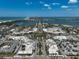Panoramic aerial shot of a vibrant coastal town featuring shops, businesses, and a bustling roundabout near the water at 322 S Washington Dr, Sarasota, FL 34236