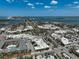 High aerial view of a coastal town with a waterfront roundabout, shops, and views of the surrounding waters at 322 S Washington Dr, Sarasota, FL 34236