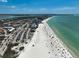 Expansive aerial view of a beautiful beach with turquoise water and beachgoers enjoying a sunny day at 322 S Washington Dr, Sarasota, FL 34236