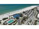 Overhead view captures a beachside community with a pool, beach access, and vibrant, tourist-friendly amenities at 322 S Washington Dr, Sarasota, FL 34236