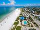 Stunning aerial view of a beautiful beach, pool and oceanfront community on a sunny day at 322 S Washington Dr, Sarasota, FL 34236
