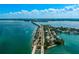 Beautiful sunny aerial view of bridge to waterfront property and community at 322 S Washington Dr, Sarasota, FL 34236