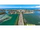 Stunning aerial view of waterfront property, community, bridges, and turquoise waters on a bright day at 322 S Washington Dr, Sarasota, FL 34236