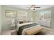 Bright bedroom with a neutral color palette, large windows, and ceiling fan for a relaxing ambiance at 322 S Washington Dr, Sarasota, FL 34236