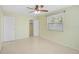 Bright, empty bedroom with a ceiling fan and closet at 322 S Washington Dr, Sarasota, FL 34236