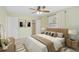 Comfortable bedroom with neutral color scheme, ceiling fan, and ample natural light at 322 S Washington Dr, Sarasota, FL 34236