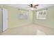 Bedroom with two windows, ceiling fan, and neutral decor providing ample natural light at 322 S Washington Dr, Sarasota, FL 34236