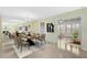 Formal dining room with large mirror, chandelier, and a long wood table and an open floor plan at 322 S Washington Dr, Sarasota, FL 34236