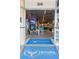 Entrance to Wyland Galleries features art displays and a branded welcome mat at 322 S Washington Dr, Sarasota, FL 34236