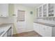 Bright kitchen with all white cabinetry at 322 S Washington Dr, Sarasota, FL 34236