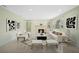 Bright living room with fireplace, large window, and contemporary furniture for a comfortable gathering space at 322 S Washington Dr, Sarasota, FL 34236