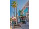 Outdoor seating at Lynches Pub & Grub, with sidewalk tables, palm trees, and signage at 322 S Washington Dr, Sarasota, FL 34236
