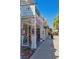 Exterior view of Settimi's Artisan Gelato and other boutiques, with a vibrant sidewalk scene at 322 S Washington Dr, Sarasota, FL 34236