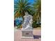 Detailed Neptune statue is featured in a landscaped St. Armand's Circle location surrounded by palm trees at 322 S Washington Dr, Sarasota, FL 34236