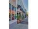 A diverse collection of storefronts along the sidewalk each with individual aesthetics and signage at 322 S Washington Dr, Sarasota, FL 34236