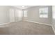 This neutral bedroom has two windows providing great natural light and a pair of large closets for ample storage at 3413 5Th W Dr, Palmetto, FL 34221