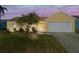 Charming home exterior with well-maintained lawn, tasteful landscaping and two car garage at 3413 5Th W Dr, Palmetto, FL 34221