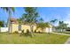 A charming single-Gathering home showcasing the front yard, appealing landscaping and lovely architecture at 3413 5Th W Dr, Palmetto, FL 34221